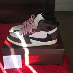 Travis Scott Air Jordan 1s and sweatpants